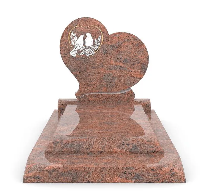 Monument funéraire en granit rouge sculpté en forme de cœur gravé de deux colombes